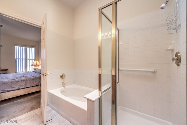 bathroom with tile patterned flooring and independent shower and bath