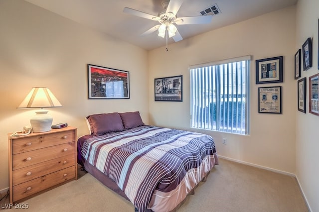 bedroom featuring light carpet and ceiling fan