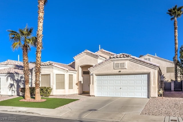 mediterranean / spanish-style home featuring a garage