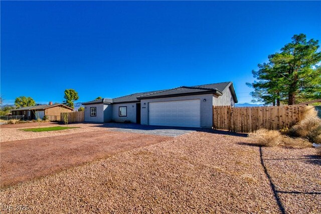 ranch-style home with a garage