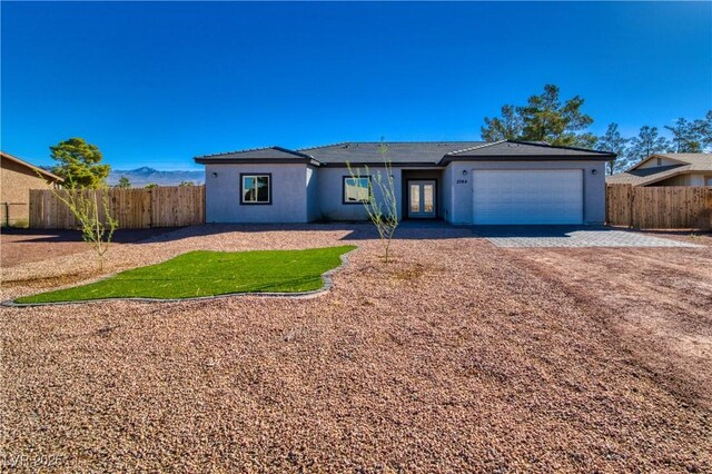 single story home with a garage