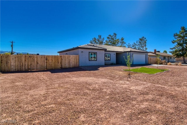 single story home featuring a garage