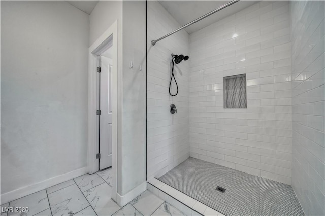 bathroom with tiled shower