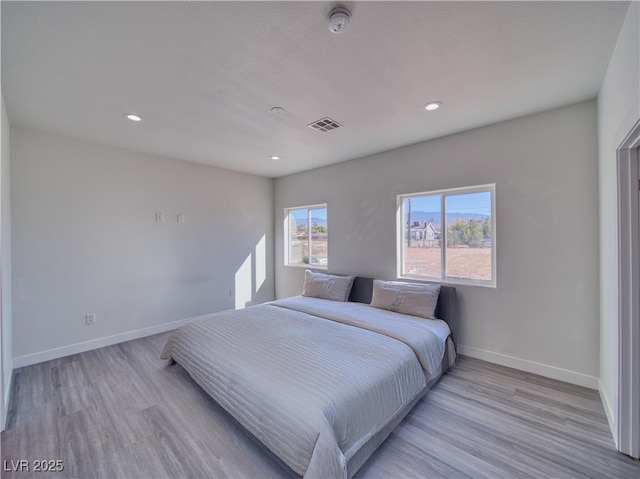 bedroom featuring light hardwood / wood-style floors