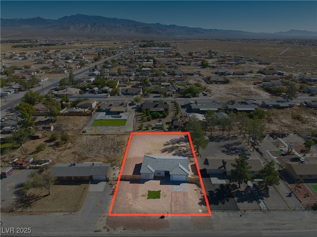 birds eye view of property featuring a mountain view