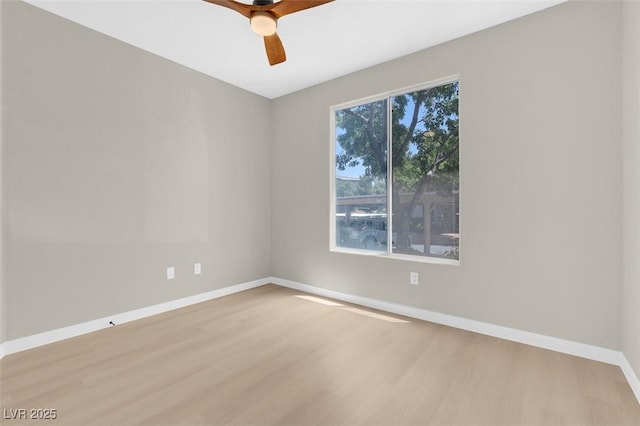 empty room with ceiling fan and light wood-type flooring