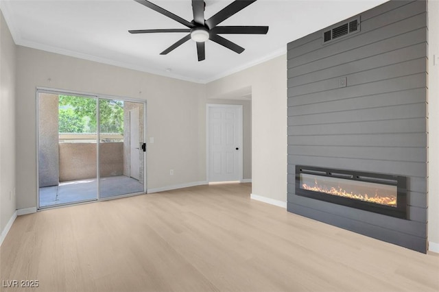 unfurnished living room with a fireplace, light wood-type flooring, ceiling fan, and ornamental molding