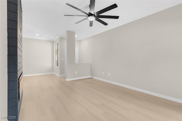 unfurnished living room with ceiling fan, light hardwood / wood-style floors, and ornamental molding