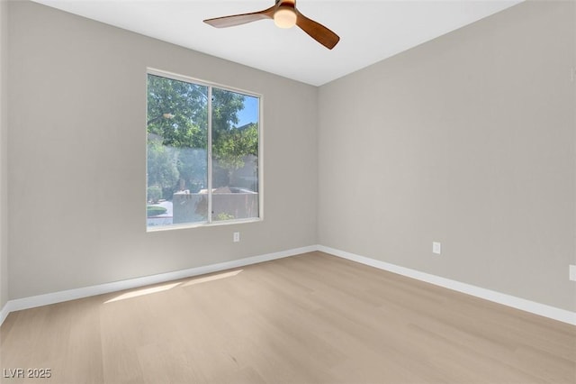 empty room featuring ceiling fan and light hardwood / wood-style floors