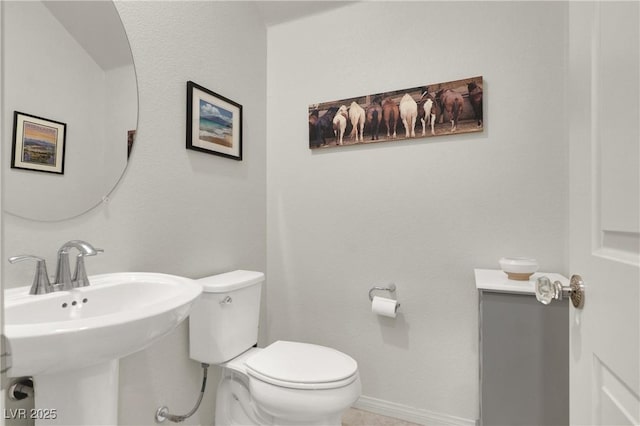 bathroom with toilet and sink