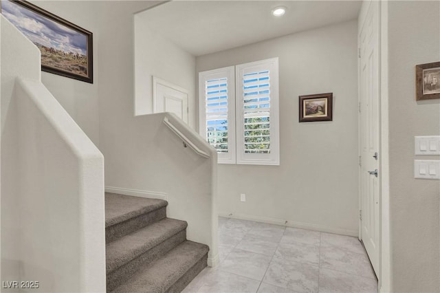 stairway with tile patterned flooring