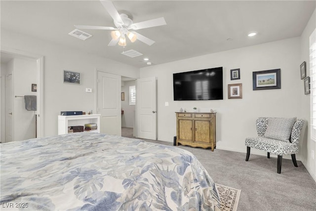 bedroom with ceiling fan and light colored carpet