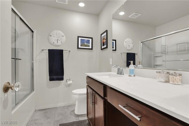 full bathroom with enclosed tub / shower combo, tile patterned flooring, vanity, and toilet