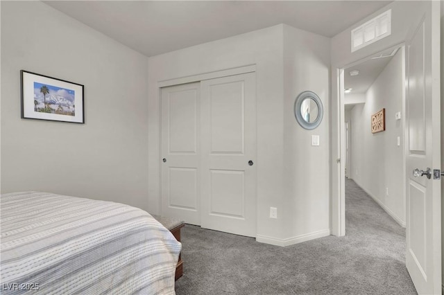 bedroom with carpet floors and a closet