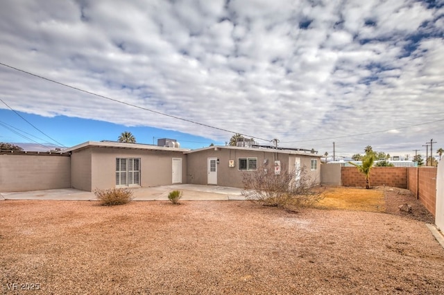 back of property featuring a patio area