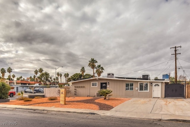 single story home featuring central air condition unit