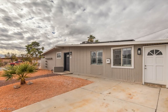 entrance to property with a patio