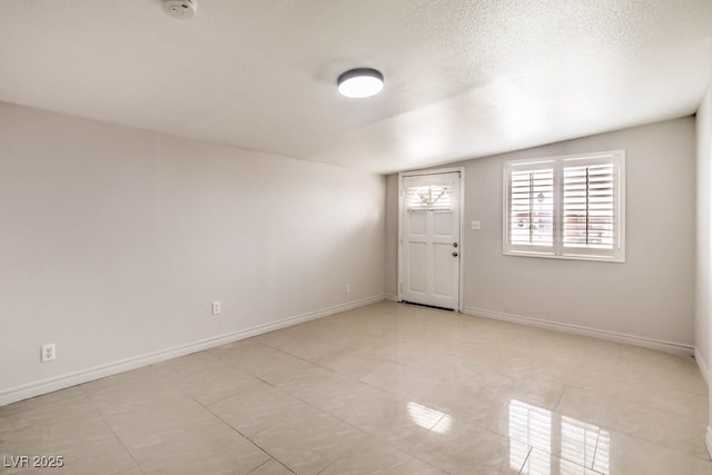 spare room with lofted ceiling