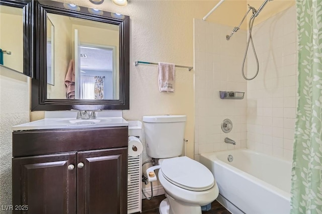 full bathroom with vanity, shower / bath combination with curtain, and toilet