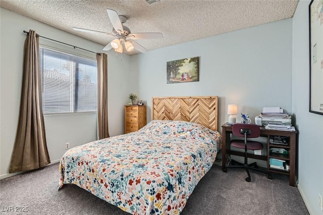 carpeted bedroom with ceiling fan and a textured ceiling