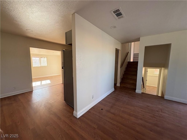 unfurnished room with dark hardwood / wood-style floors