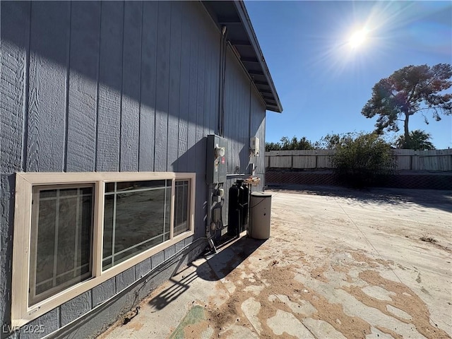 view of side of property with a patio area