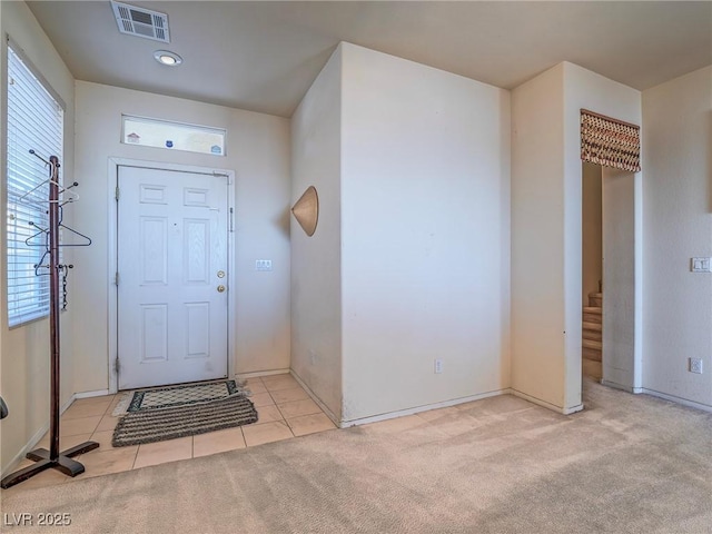 view of carpeted foyer