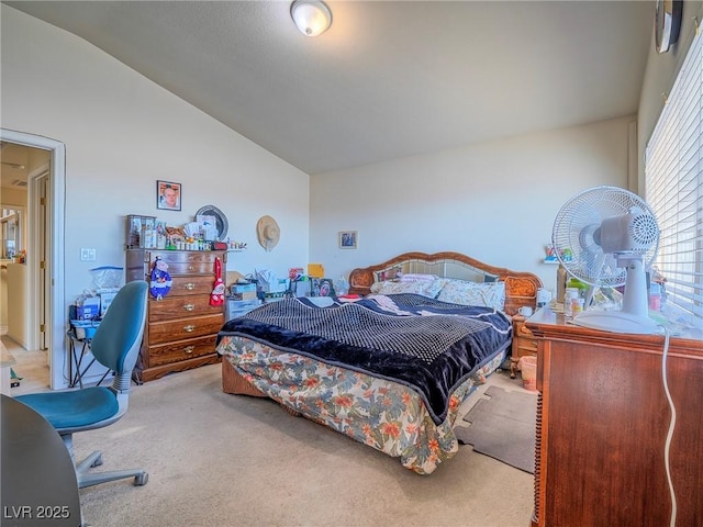 carpeted bedroom featuring lofted ceiling