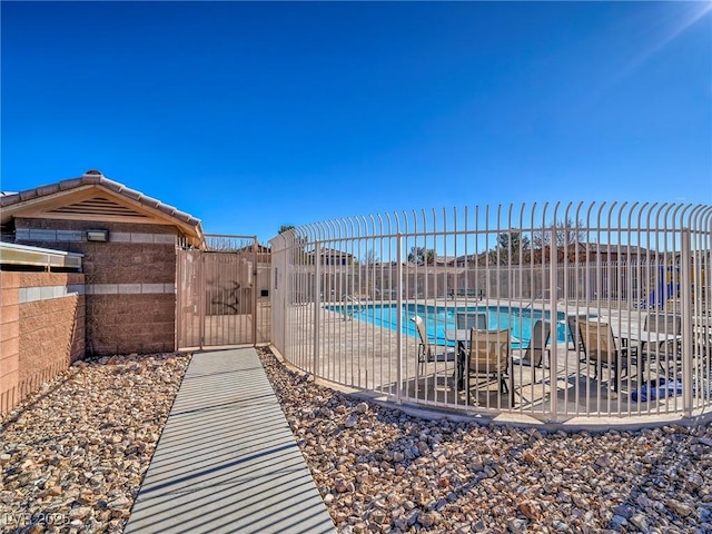 view of swimming pool featuring a patio area