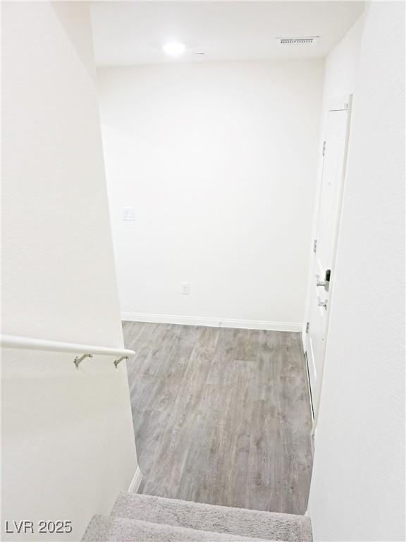 unfurnished room featuring hardwood / wood-style floors