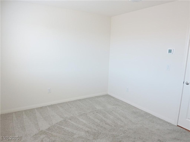 unfurnished room with light carpet