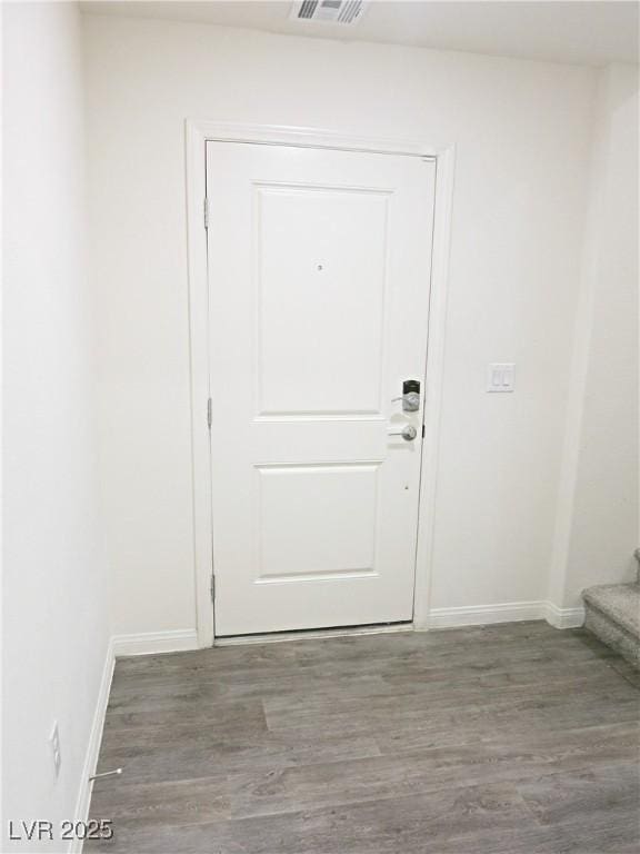 entryway featuring dark wood-type flooring