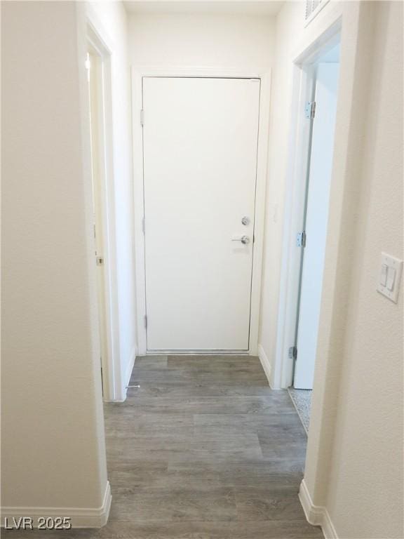 hallway featuring hardwood / wood-style flooring