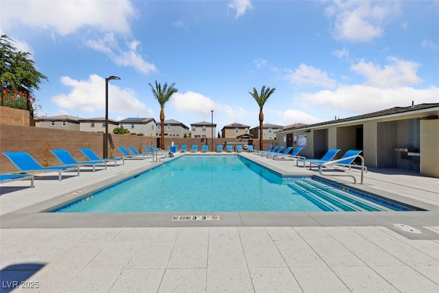 view of swimming pool featuring a patio area