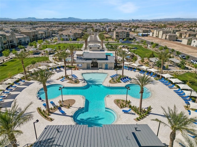 view of pool with a patio area and a mountain view