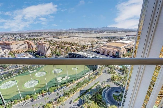 balcony featuring a mountain view