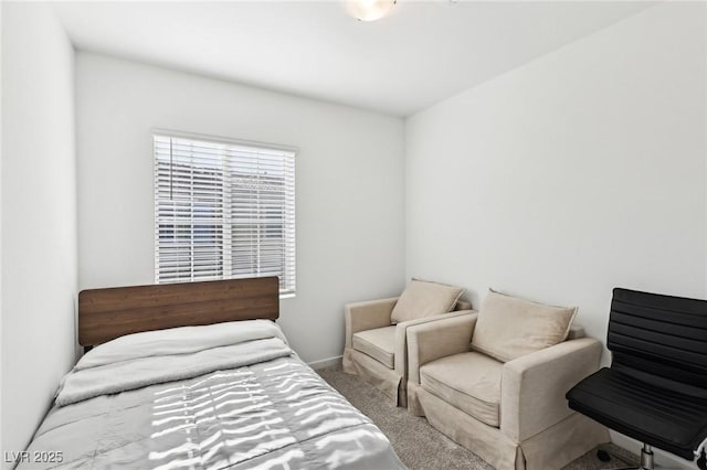 bedroom featuring light colored carpet