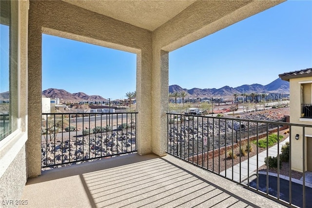 balcony featuring a mountain view