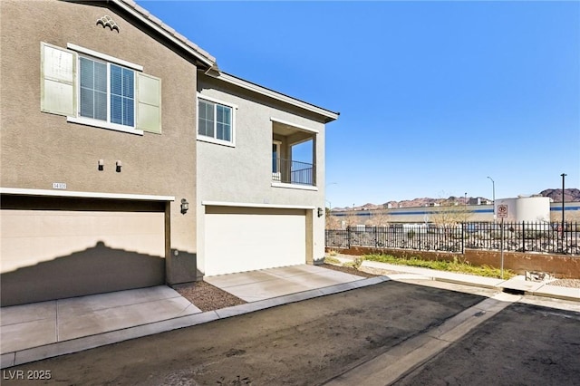 view of side of home with a garage