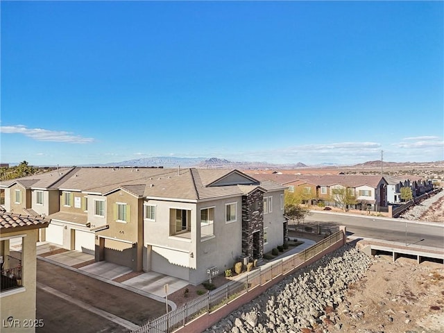 exterior space with a mountain view and a garage