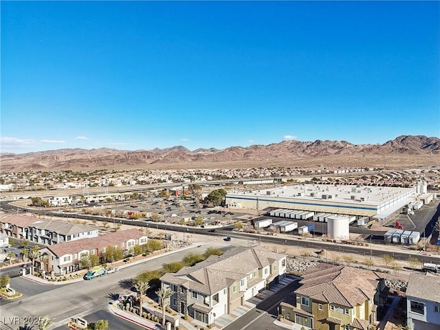 birds eye view of property with a mountain view