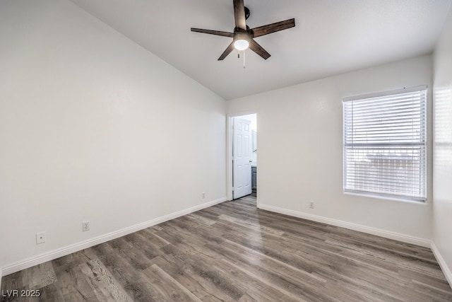 spare room featuring ceiling fan, vaulted ceiling, and hardwood / wood-style flooring