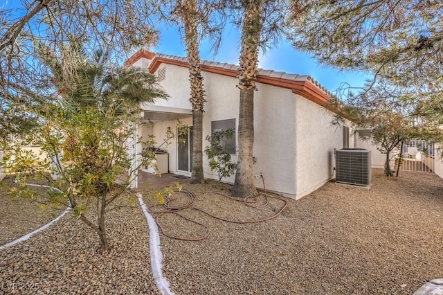 view of home's exterior with central AC unit