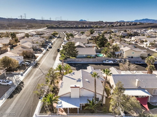 birds eye view of property featuring a mountain view