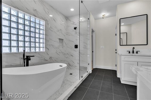 bathroom with tile patterned floors, vanity, and independent shower and bath