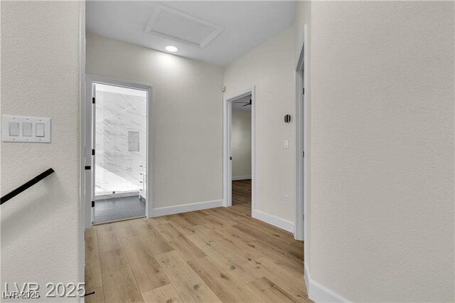 hallway with light wood-type flooring