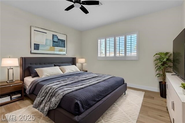 bedroom featuring light hardwood / wood-style flooring and ceiling fan