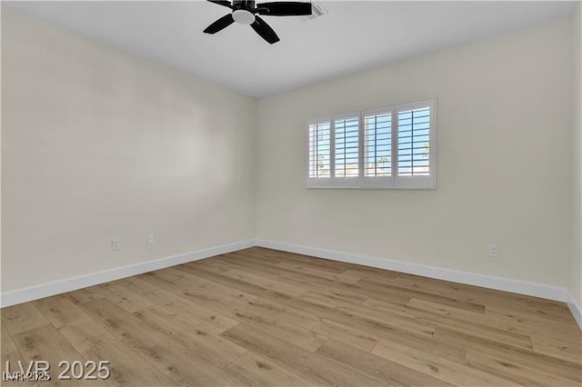 empty room featuring light wood-type flooring and ceiling fan