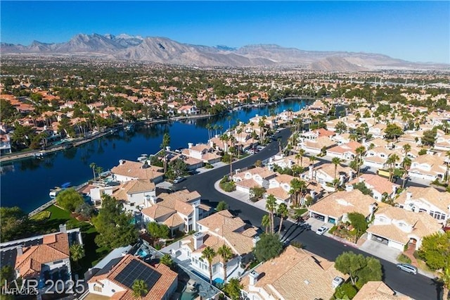 bird's eye view featuring a water and mountain view