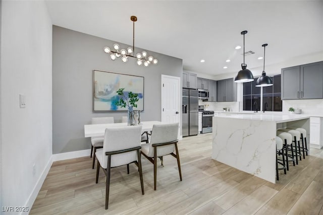 dining space featuring a chandelier